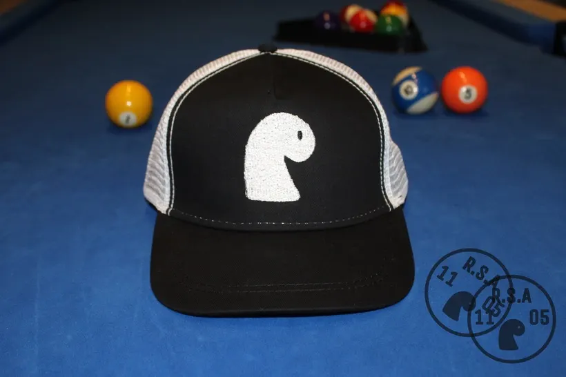Black mesh trucker cap with white embroidered EMVŸ mark