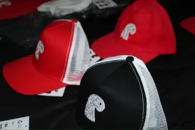 Red and black EMVŸ trucker caps