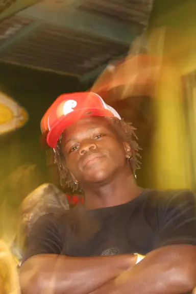 Close portrait of an Earthian in an orange cap