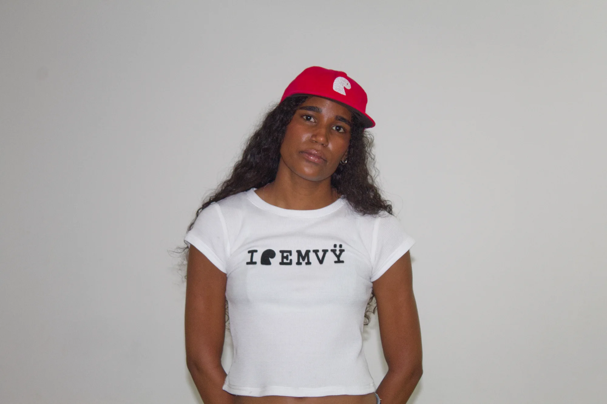 Red corduroy EMVŸ cap worn front-on