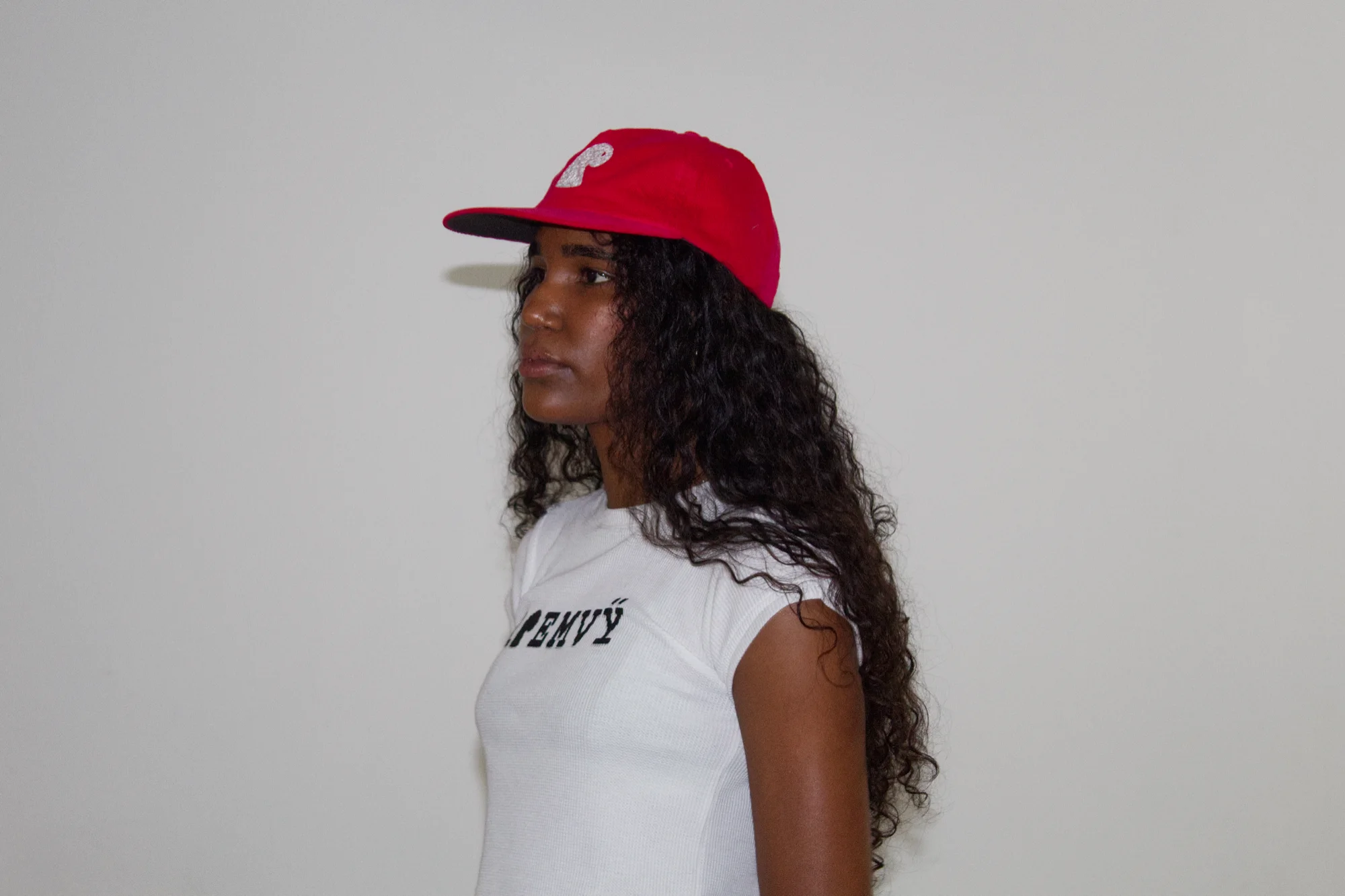 Red corduroy EMVŸ cap in profile