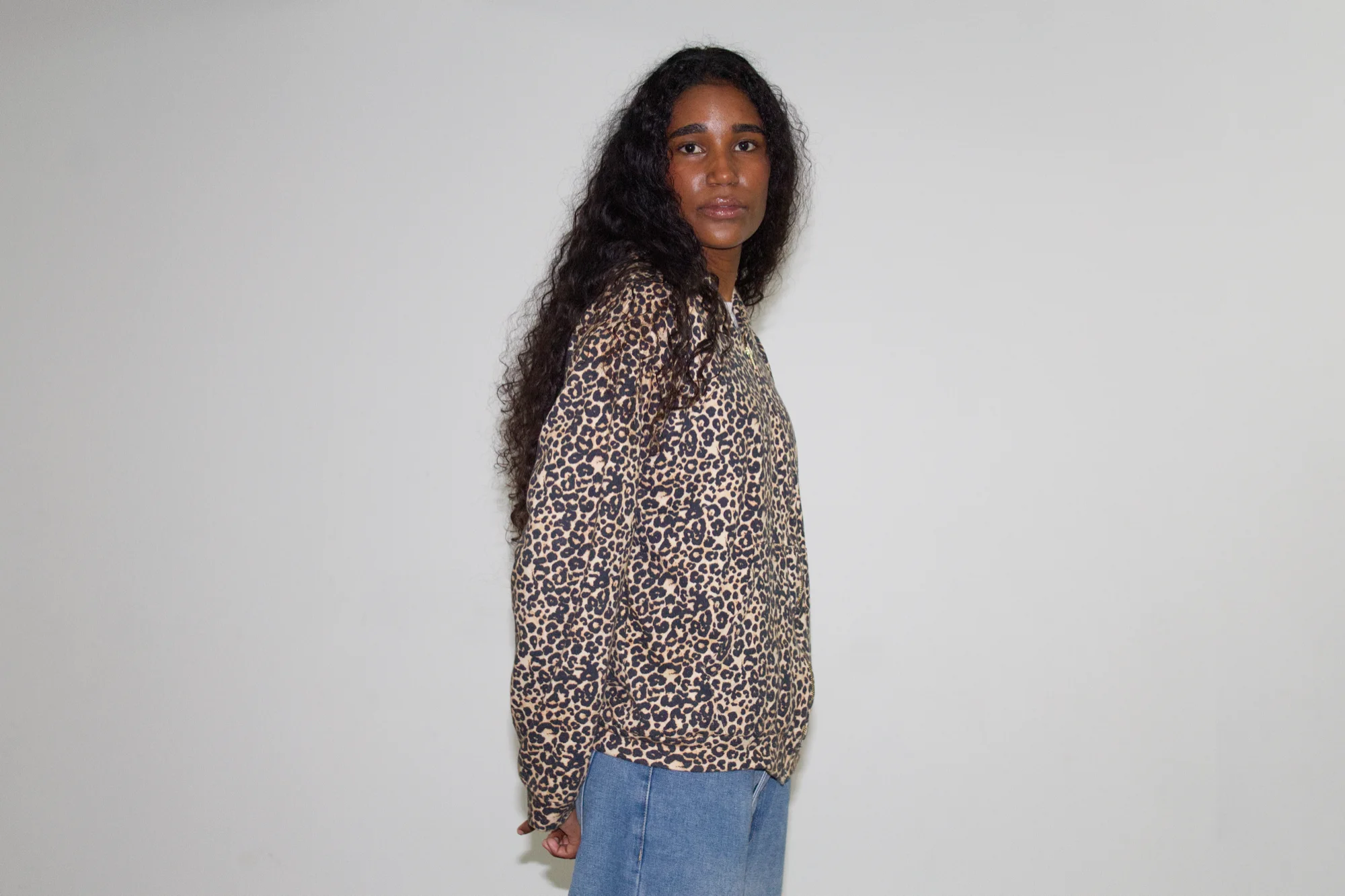 Leopard-print EMVŸ cheater hoodie in profile