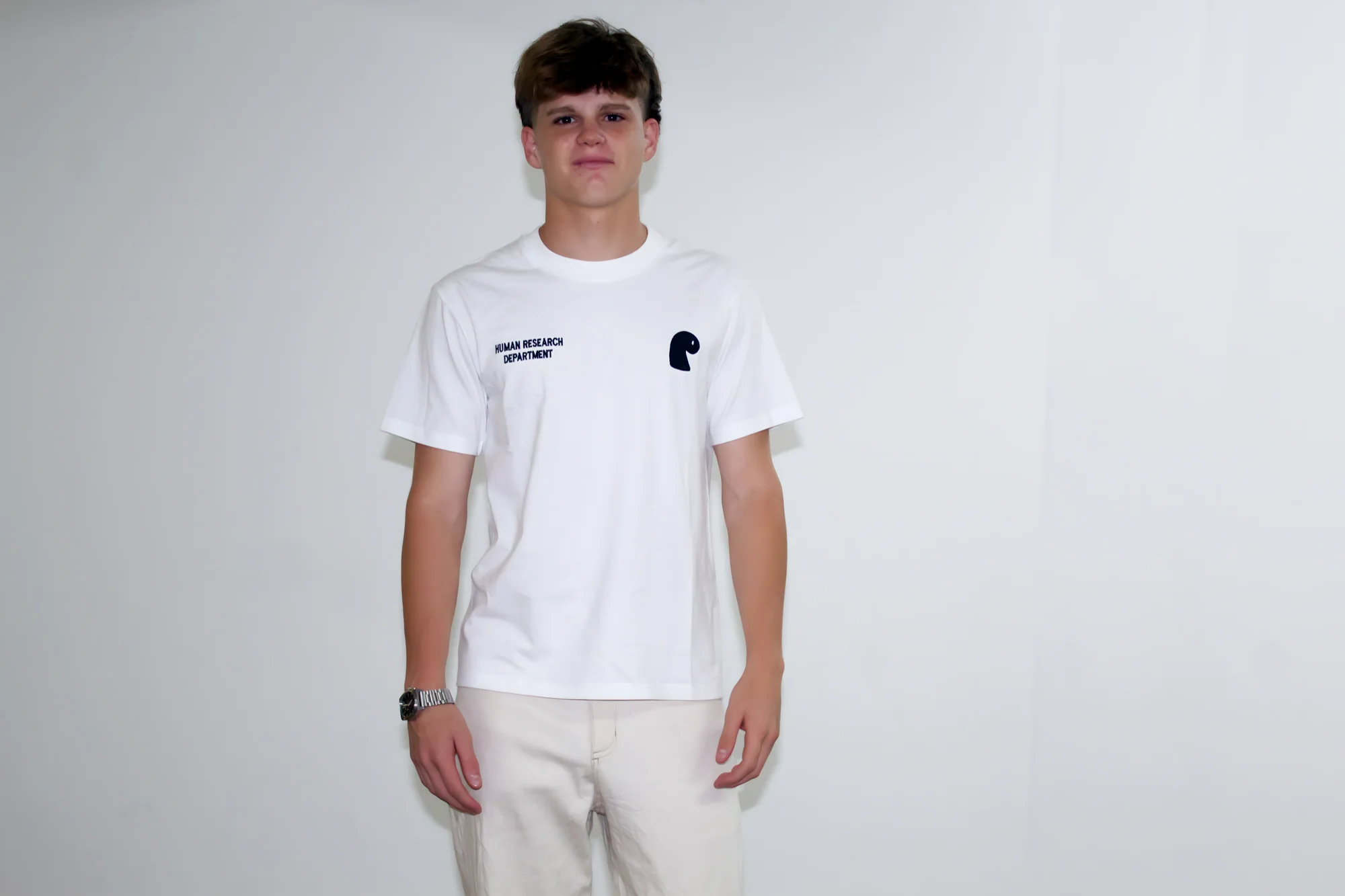 HRD T-shirt worn front-on, Human Research Department embroidery and the EMVŸ mark on the chest