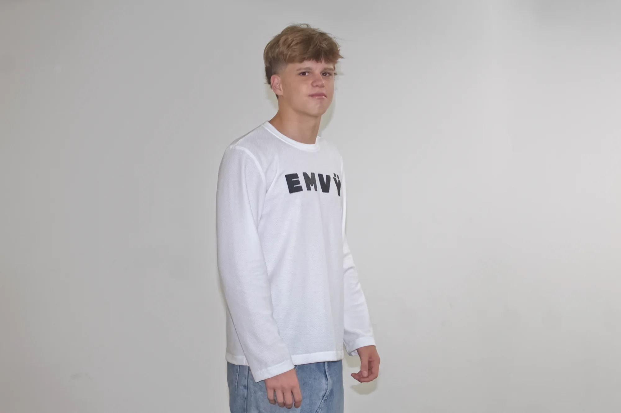White EMVŸ waffle longsleeve from a three-quarter angle