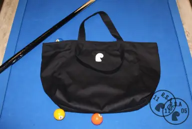 Black EMVŸ big tote bag on blue pool table felt