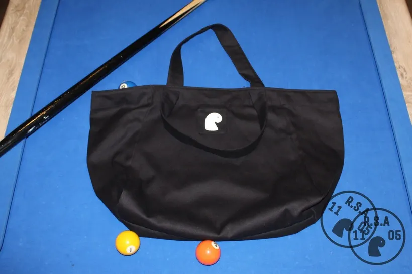 Black EMVŸ big tote bag on blue pool table felt